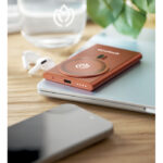 Wireless charger power bank Orange mit markiertem Druckbereich für Ihr Logo